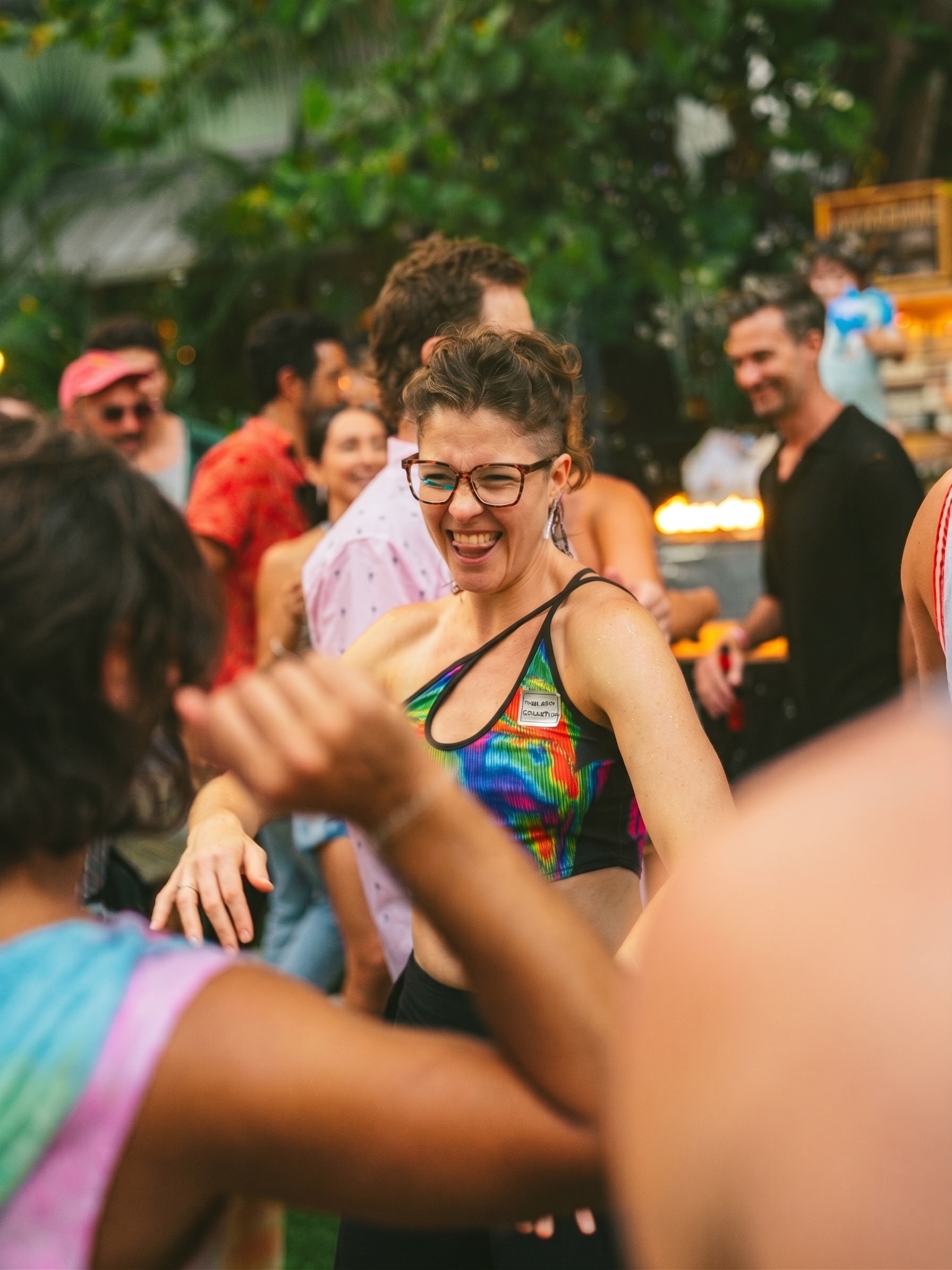 A guest laughing while dancing in the Season 1 crowd