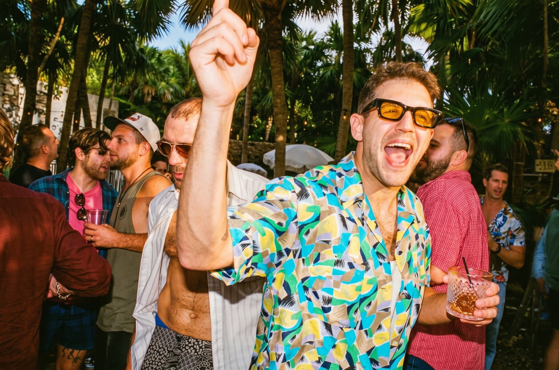 An energetic guest dancing in the Miami sunshine during Season 1
